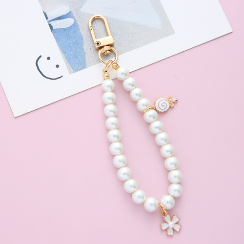 Retro trendy brand pearl key chain wholesale antique simple small pendant alloy key chain mobile phone chain bag pendant