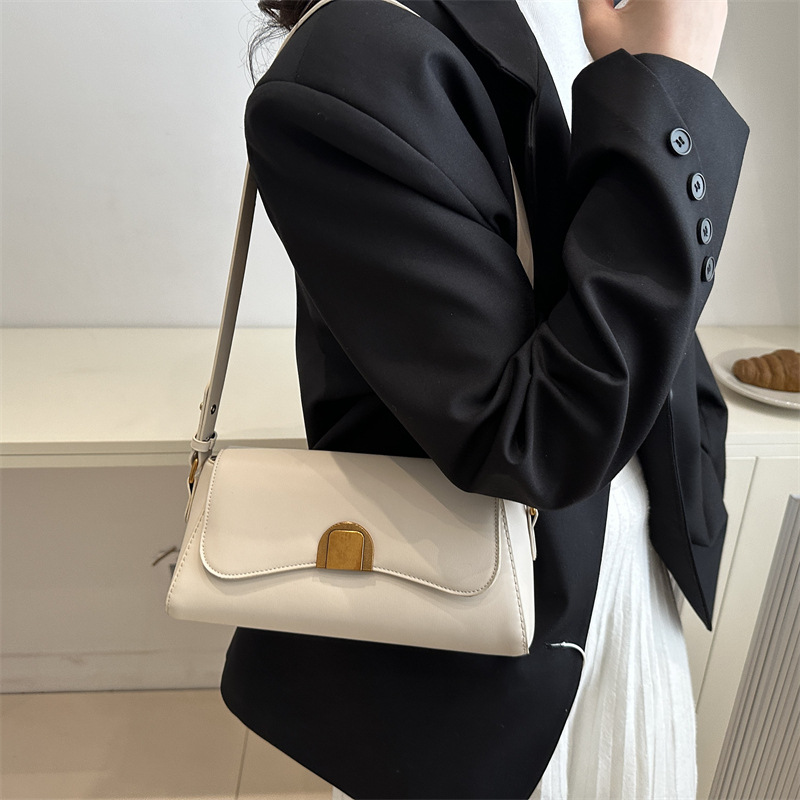 Bolso de brazo retro de palo para mujeres 2025 nuevo nicho de moda de alta sensación bolso de hombro universal bolso de mochila