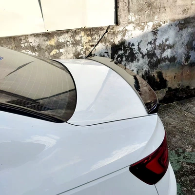 features a fixed spoiler design that – Fixed wind wing