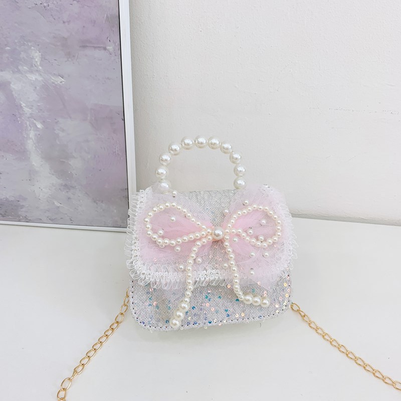Accesorios para niños bolsos de moda de verano bolsos de mochila para chicas bolsos de mano princesa de perlas bolsos de cambio de viento fragante