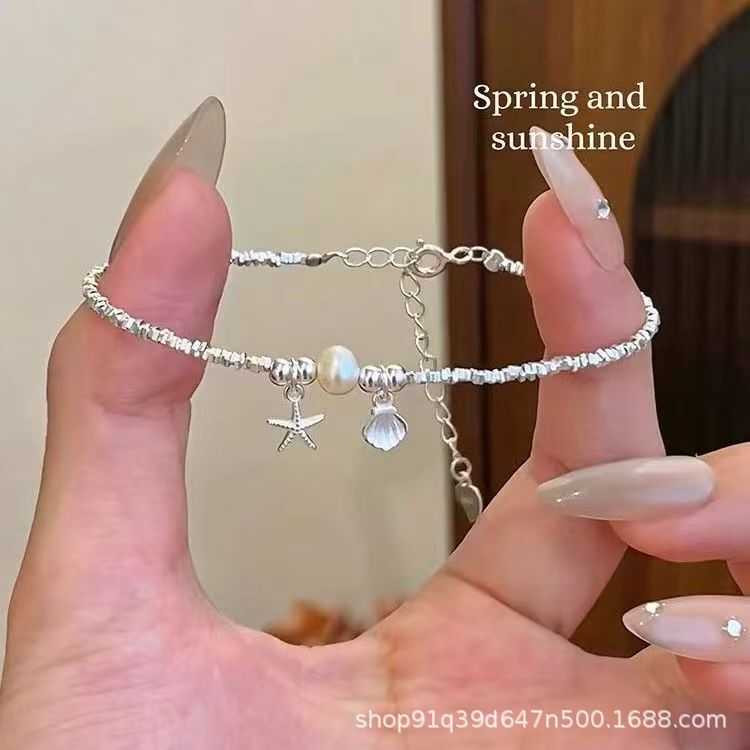 Sweet and Simple Silver Bracelet with Shells, Stars, and Pearls for Women, Niche Design with a High-End and Elegant Feel, Wholesale Jewelry Sweet and Simple Silver Bracelet with Shells, Stars, and Pearls for Women, Niche Design with a High-End and Elegant Feel, Wholesale Jewelry