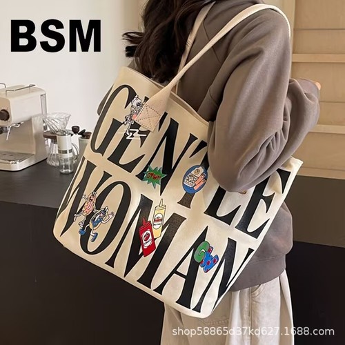 Autumn and winter large-capacity bucket bag for women, 2025 new style, niche cartoon canvas tote bag, college student's shoulder tote bag
