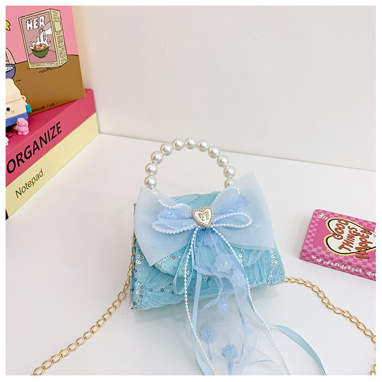 Nuevo bolso de moda para niños bolso de perla animado lindo arco de botón bolso de hombro de niñas cadena diagonal bolso pequeño