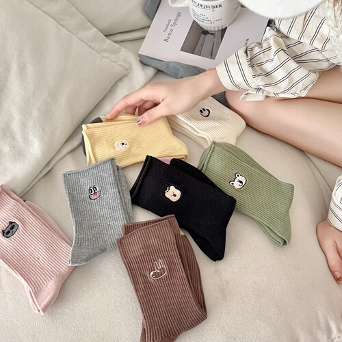 25 spring and summer socks women's middle tube boneless imitation double needle Korean embroidery pile socks internet celebrity cartoon smiling face long tube luck