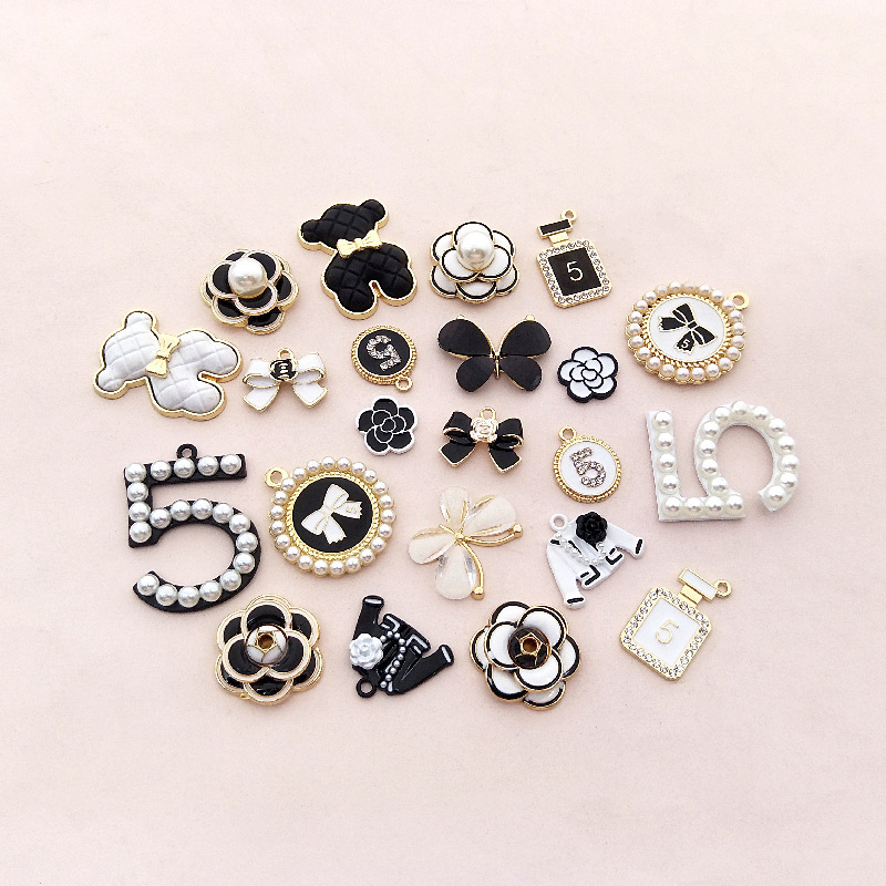 New drop oil inlaid pearl Camellia accessories car bag bow tie phone case beauty alloy accessories