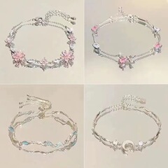 ピンクのジルコンの桜の蝶結びのブレスレットの女性ins小衆の軽い豪華な気質の高級な清冷感の女性の手は女性を飾ります。