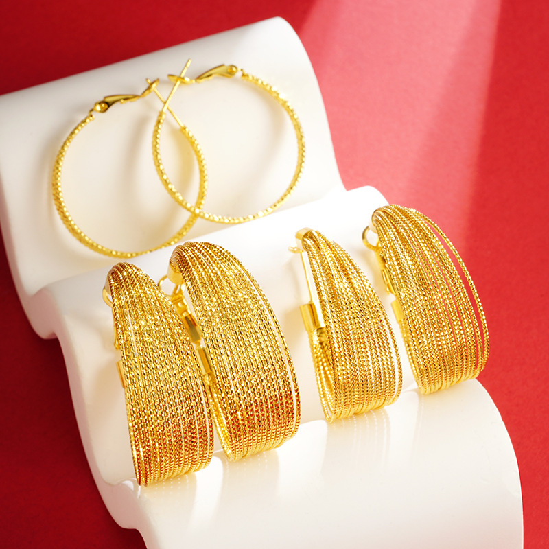 Vietnam arena oro multi-capa pendientes de plata aguja nicho diseño bobinado estilo europeo y americano aleación de cobre color retención pendientes todo partido suministro