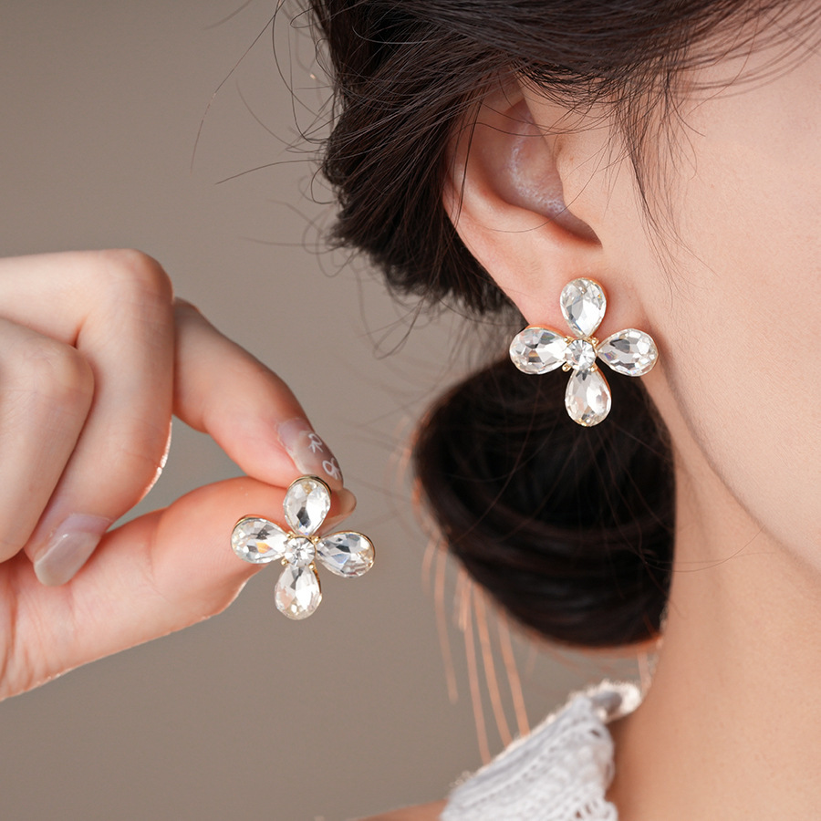 Pendientes de flor de lazo elegante de súper hada de plata Pendientes de moda de lujo ligero francés Pendientes de todo fósforo dulce de estilo literario