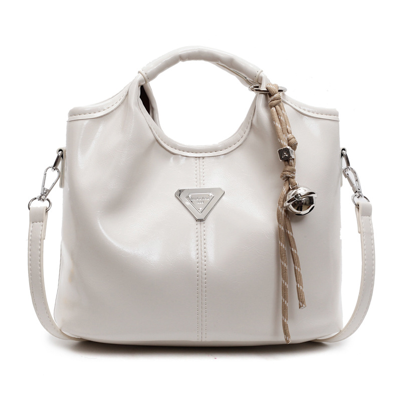 Popular bolso de mano super caliente para mujeres 2025 nueva moda versátil bolso de hombro para viajar bolso de cubo de textura superior