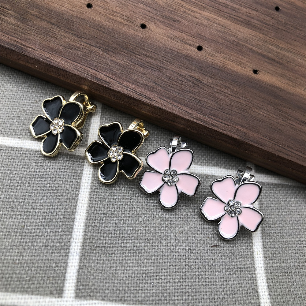No Need for Ear Piercings, Clip-On Earrings with Plum Blossom Design, Fashionable Women's Earrings in Black and Pink, with Oil-Drip and Rhinestone Details, Fresh and Sweet