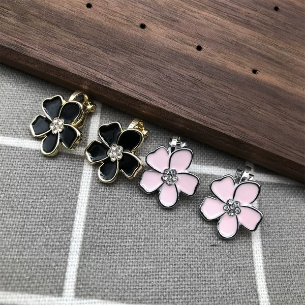 No Need for Ear Piercings, Clip-On Earrings with Plum Blossom Design, Fashionable Women's Earrings in Black and Pink, with Oil-Drip and Rhinestone Details, Fresh and Sweet
