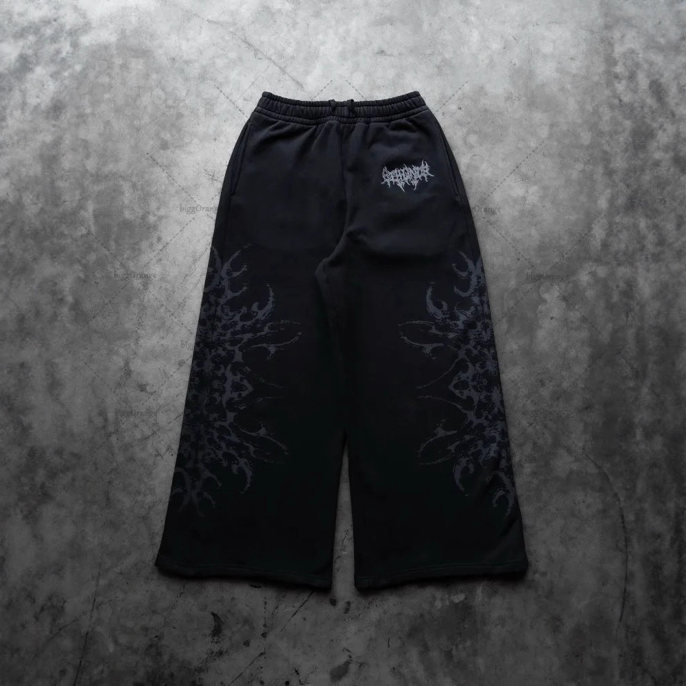 Europa y Estados Unidos transfronterizos estadounidenses tendencia hip-hop personalidad callejera pull-out pantalones casuales de moda impresa pantalones rectos sueltos