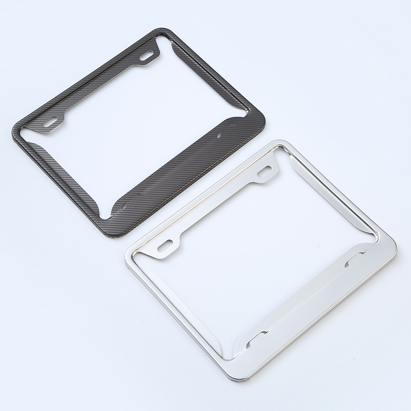 El fabricante suministra el marco estándar americano de la placa de matrícula de fibra de carbono de acero inoxidable cubierta protectora transfronteriza antirrobo multifuncional marco de la placa