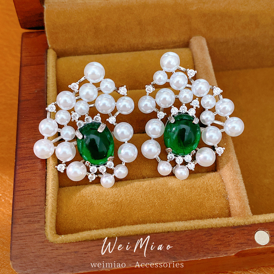 Agujas de plata de piedra de perla oval pendientes de perla estilo palacio delicado pendientes de nicho ligero lujo alta sensación auriculares al por mayor