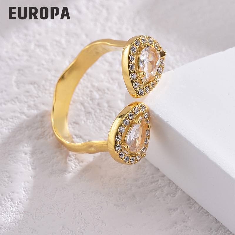 Diseño de nicho de alto grado flor ZIRCON anillo abierto luz femenina estilo de lujo europeo y americano elegante anillo ajustable de acero de titanio