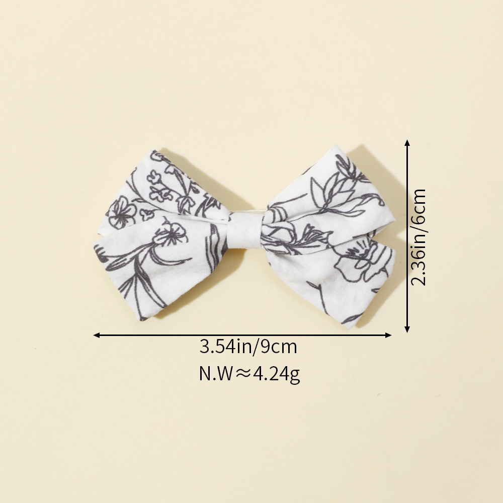 Fermagli per capelli con fiocco per bambine clip stampate_voghion.com