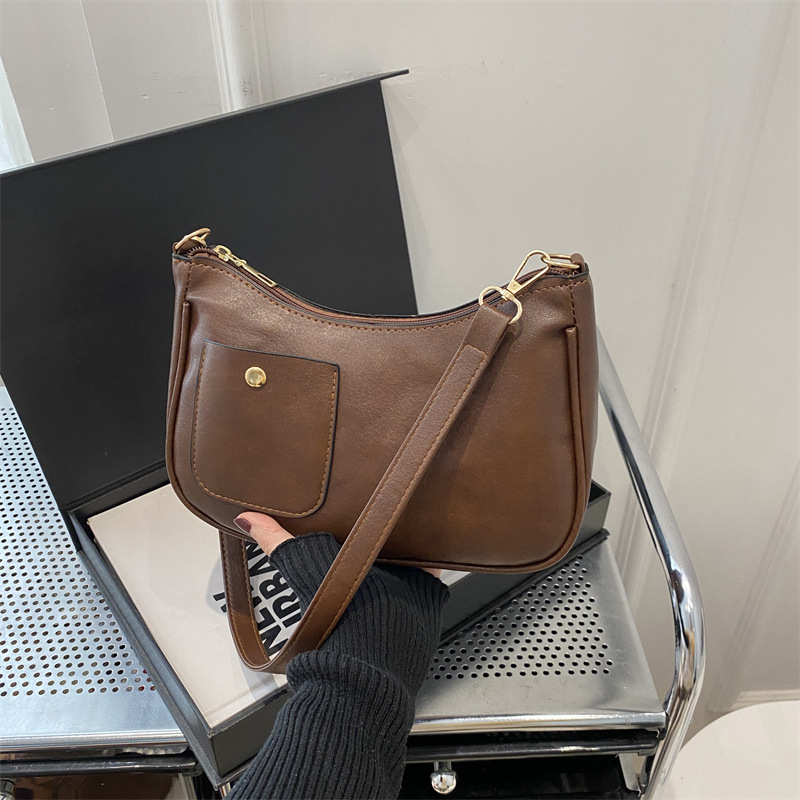Bolso de mujer retro coreano personalidad 2025 bolso de media luna de hombro de estilo nuevo estilo francés bolso de diseño de nicho bajo la axila