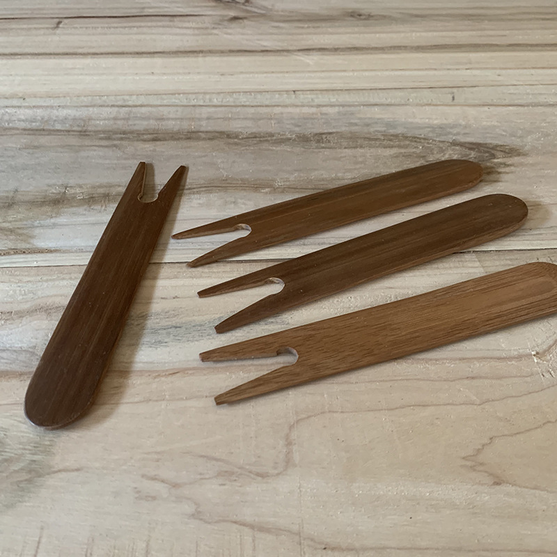 Tenedor de olla carbonizada