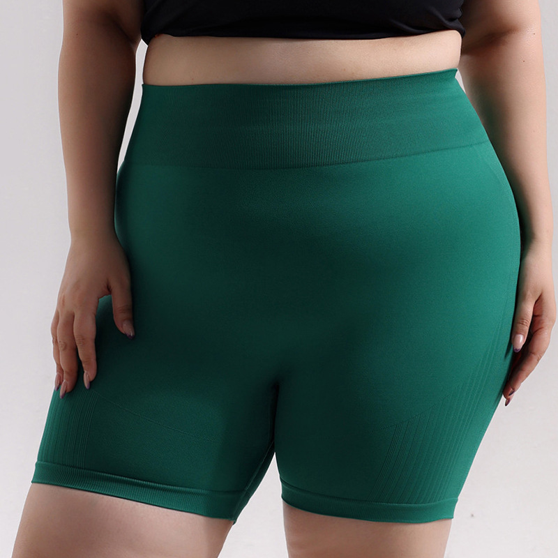 Pantalones cortos de cadera de melocotón deportivos sin costuras de gran tamaño europeos y americanos