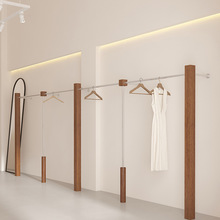 服装店展示架仿胡桃木纹上墙女装店货架不锈钢陈列架落地式挂衣杆