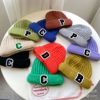 Children&#39;s knitted hats Korean Edition Simplicity letter Autumn and winter men and women baby Curling Sets of headgear Wool cap wholesale