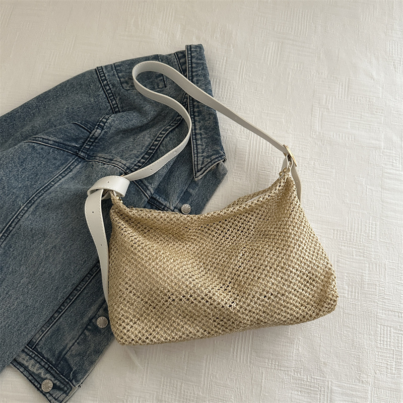 Nicho de alta sensación de bolso de tejido para mujeres 2024 nuevo tipo de viaje al trabajo bolso de paja de hombro de gran capacidad bolso de mochila