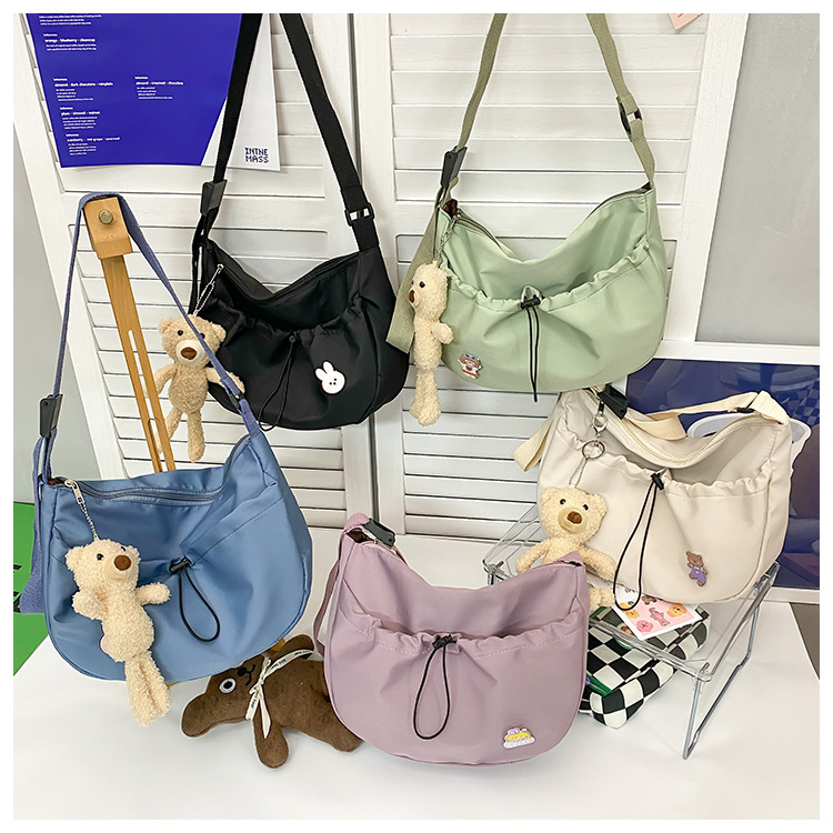 The new 2022 Little Bear canvas small bag for women is simple and versatile. The student dumpling bag is a trendy casual single-shoulder crossbody bag undefined