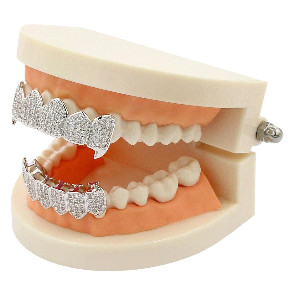 Cross-border INS popular hiphop europeo y americano hip hop oro tirantes dientes puntiagudos joyería micro incrustaciones de oro dientes decorativos fabricante