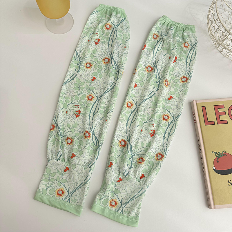 Mangas de protección solar para mujeres de verano nuevo estilo al aire libre anti-UV patrón de montar mangas de brazo de impresión de viento elegante