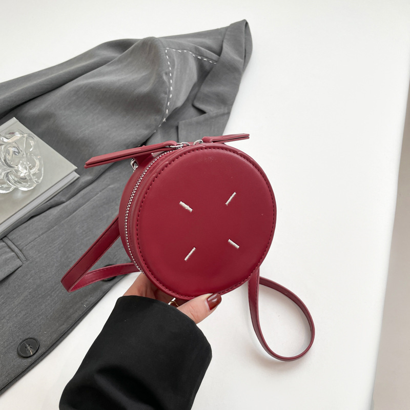 2025 early spring designer mini round cake mouth red envelope ins parent-child messenger bag concave shape travel coin purse