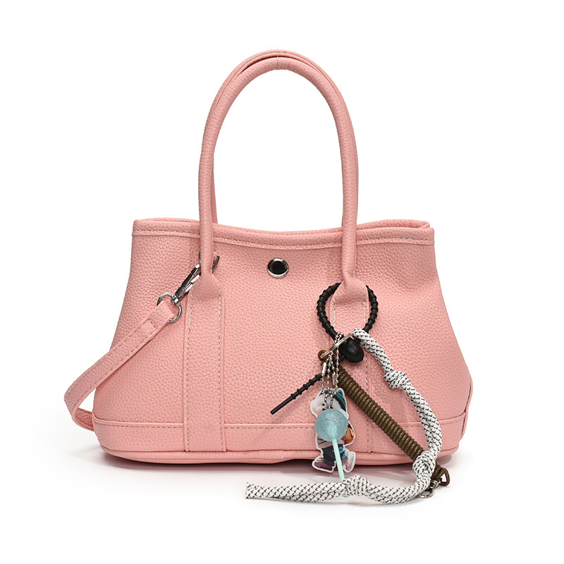 Nicho de moda explosivo bolso de cubo portátil para mujeres 2025 nuevo estilo universal simple bolso de mochila de moda extranjera bolso de mochila