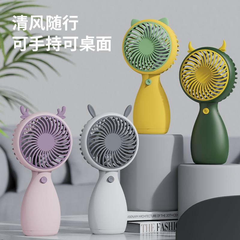 New mini handheld rechargeable fan, a children's gift with a cartoon design, portable with a lanyard, and a small pocket for outdoor use.