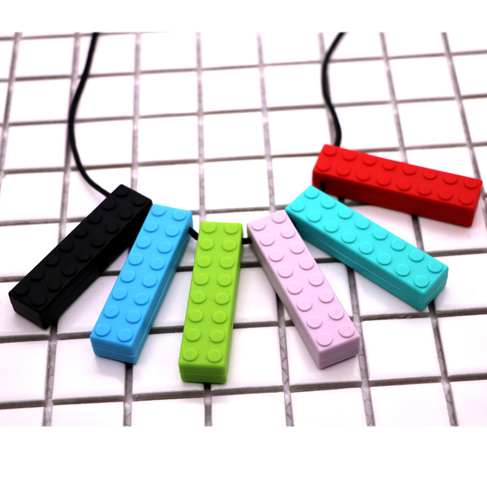 Bloques de construcción de silicona fabricantes de mordedor niños bloques de construcción de ladrillo de silicona teether sensorial masticar colgante bebé teether stick