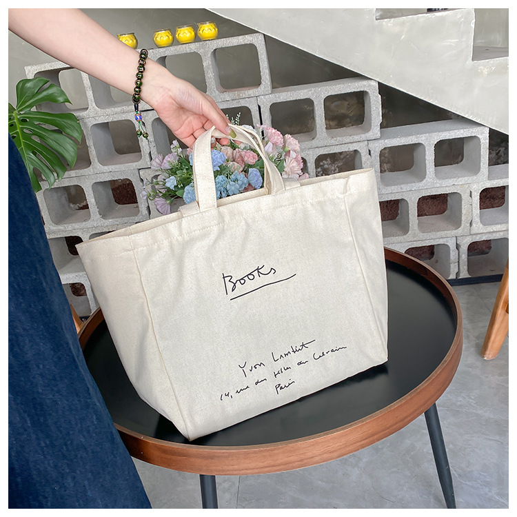 A large-capacity, sturdy Japanese-style canvas bag for women, a new 2022 simple bento handbag for girls to go to work undefined