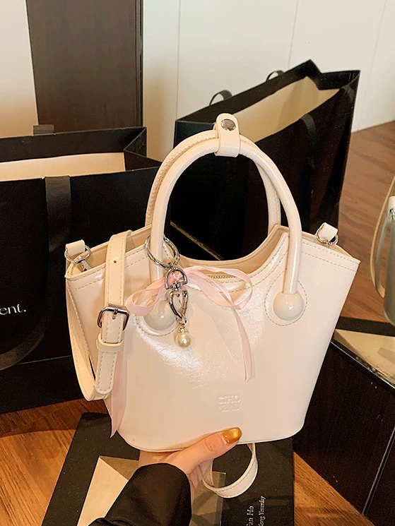 Compact summer handheld small bag, city style, top handle and shoulder strap, with/without pendant