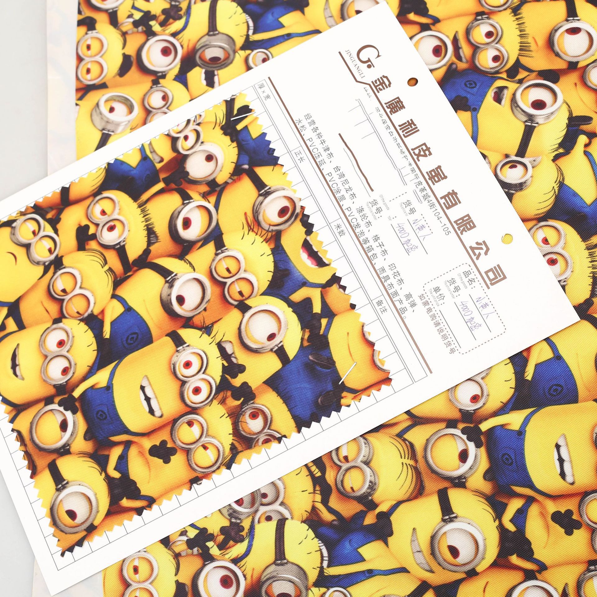 厂家供应批发现货400印花小黄人牛津布PVC皮革涤纶面料 箱包布料