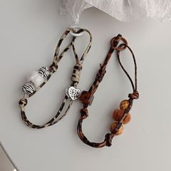 復古手工豹紋珠子miu風編織繩小眾毛球手機殼掛繩百搭包包掛飾ins