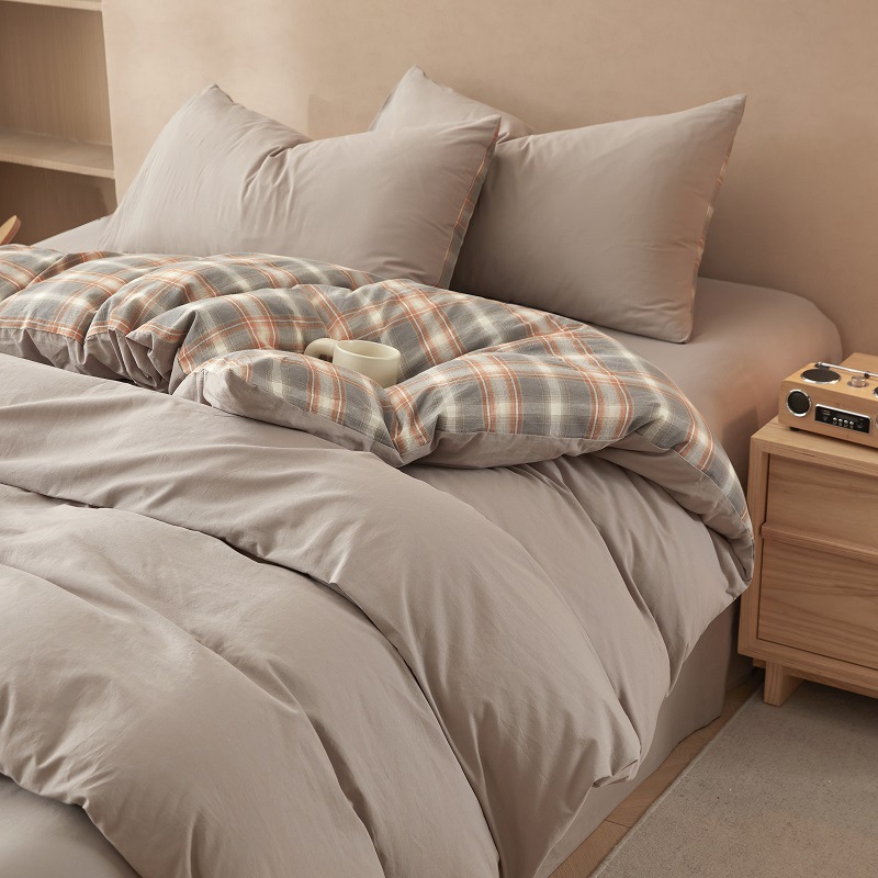 Nuevo traje de cama de algodón lavado de algodón de cuatro piezas de algodón 2025 nuevo traje de dormitorio de funda de edredón de sábana simple de tres piezas