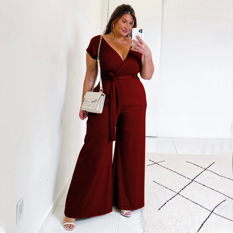 plus size short sleeve v neck lace-up wide-leg solid color jumpsuit NSLNW122683