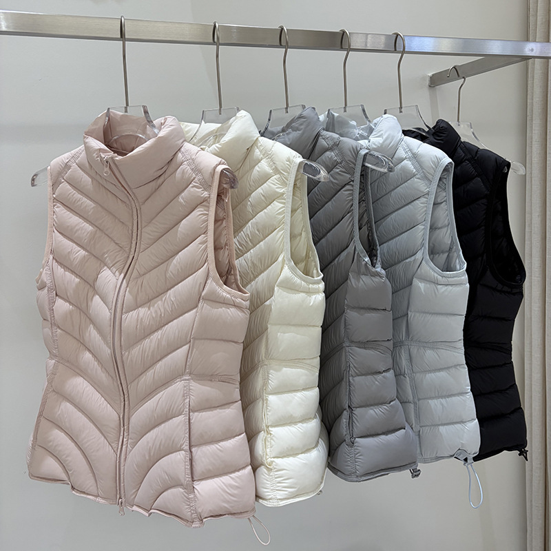 2026 new style 90% white duck down vest for women, with a stand-up collar, slim fit, and a design that accentuates the waist, resembling a ribbed vest 2026 new style 90% white duck down vest for women, with a stand-up collar, slim fit, and a design that accentuates the waist, resembling a ribbed vest