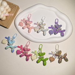 Cute windproof balloon dog keychain with bow, candy-colored 3D dog small gift accessories, car and bag pendant