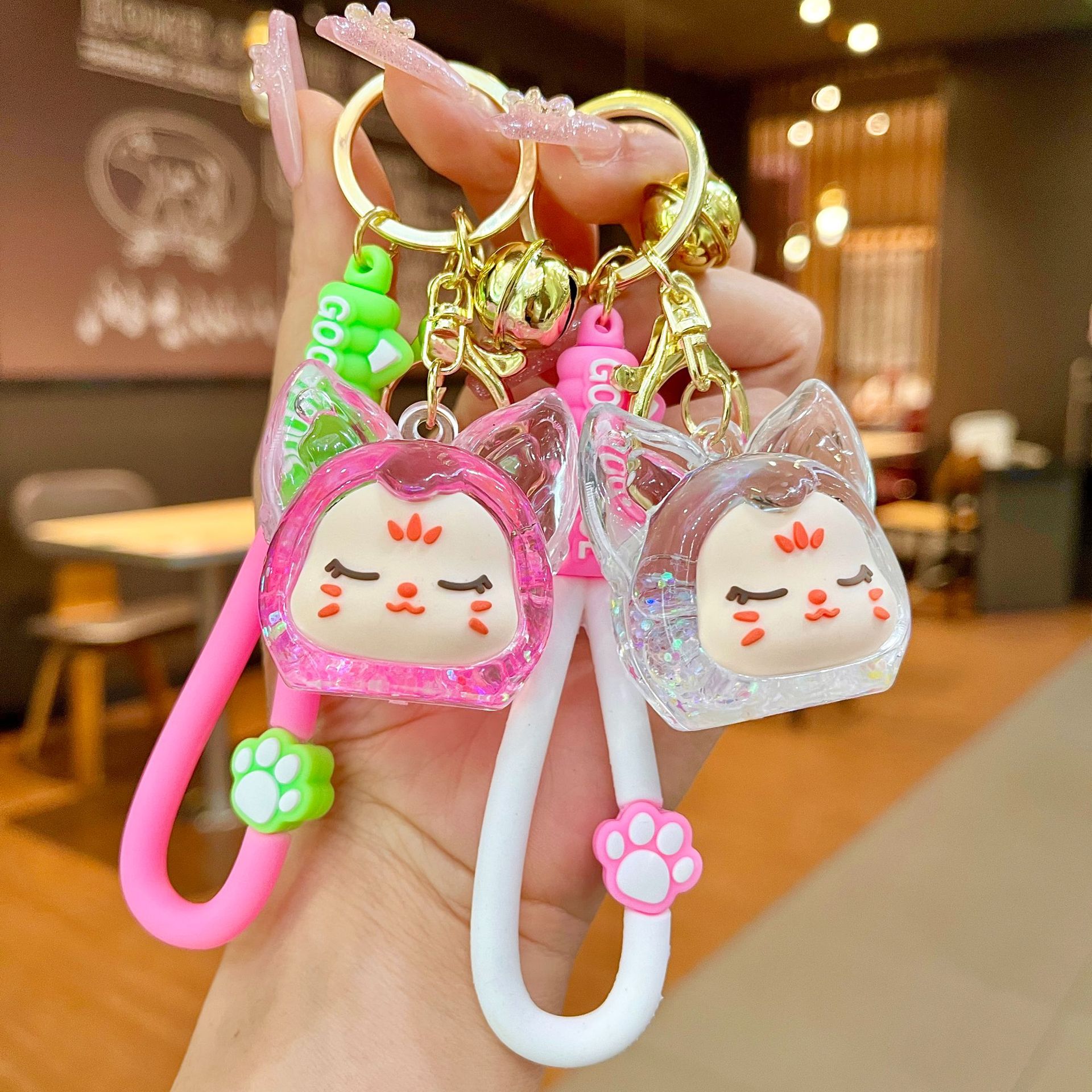 Nuevos productos acrílicos en aceite flotante botella de arena luminosa brillante nocturna KiKi zorro muñeca llavero mochila colgante bolsa al por mayor