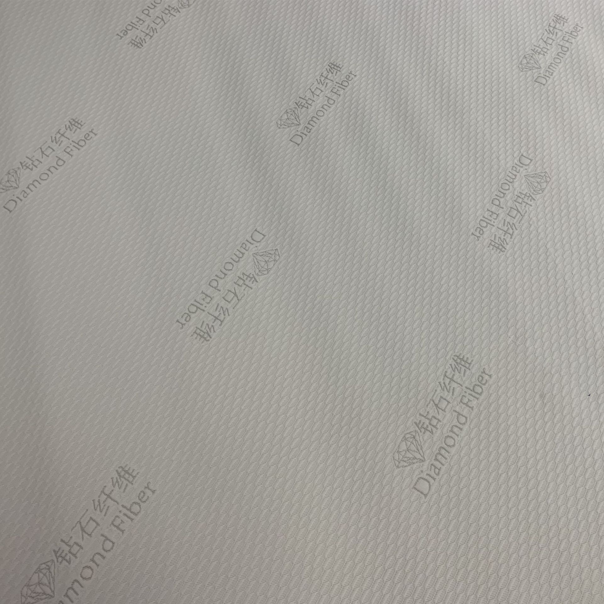 Fábrica de fuente de 180 gramos de fibra de diamante telas de colchón funcionales se pueden agregar fibra de diamante tejido Jacquard tela de colchón