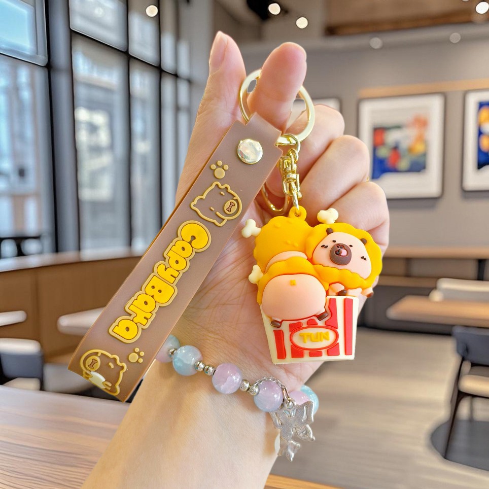 Nuevo llavero de Kapibala pareja mochila escolar colgante lindo capibara muñeca de PVC llavero de coche al por mayor