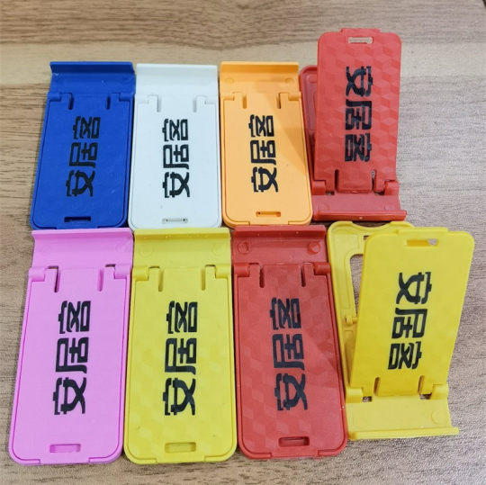 Small gifts mobile phone rack gift printing logo lazy plastic multi-stage folding mobile phone bracket desktop wholesale manufacturers