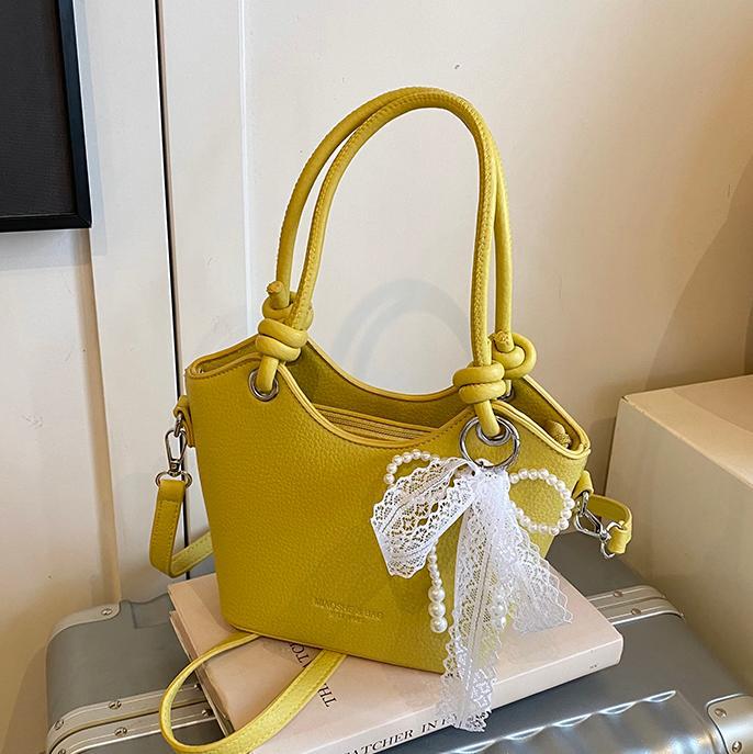 Bolso de cubo popular de este año para mujer 2025 nuevo bolso de mensajero de nicho de alta gama bolso de hombro de viajero súper caliente