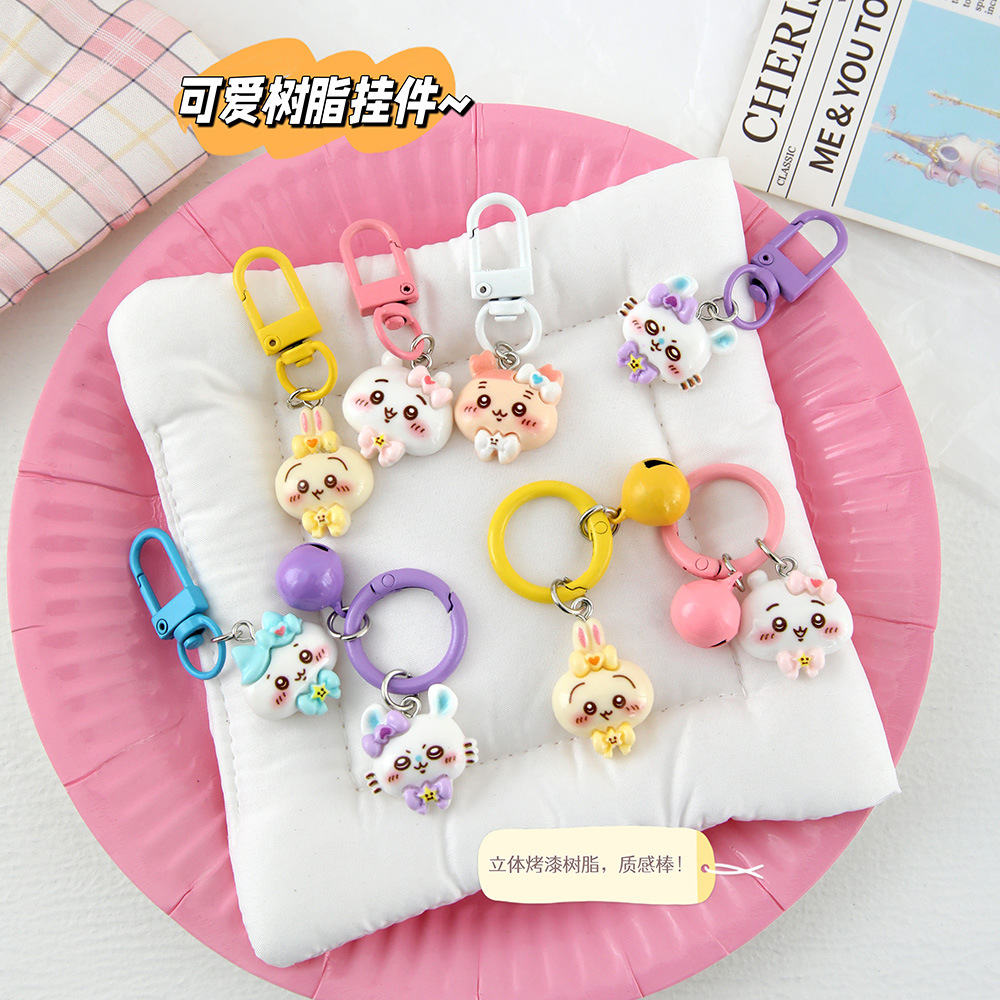 Caricatura linda corbata pequeña ocho llaveros colgantes pareja amigas bolsos colgantes de alto valor de belleza llaveros de corazón de niña