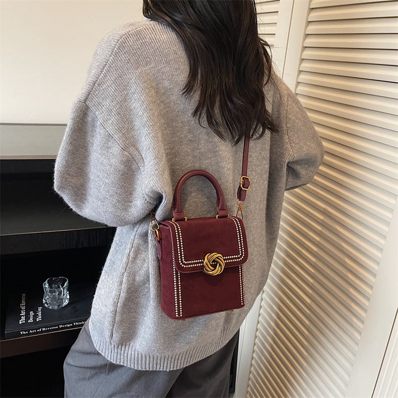 Retro alta sensación vertical bolso de mano pequeña mujer otoño / invierno 2025 nuevo estilo de moda bolso de hombro simple bolso de mochila