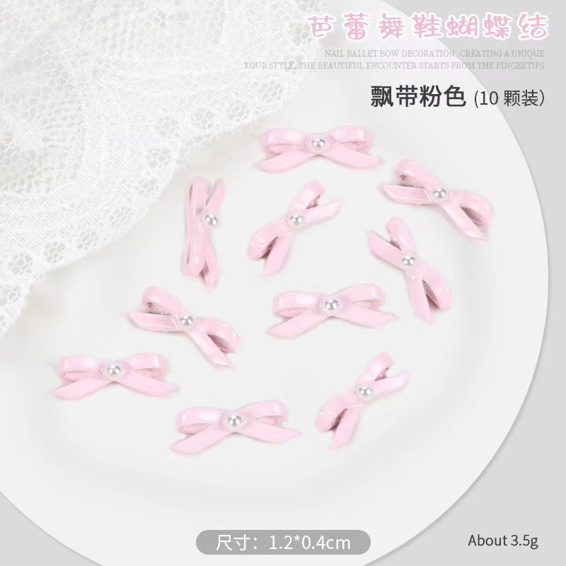 Pequeño libro rojo explosión zapatos de ballet arco flotante joyería de manicura corbata tridimensional 10 paquetes de aleación