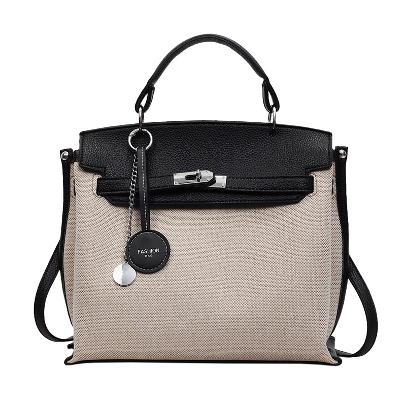 Bolso para mujeres 2026 nuevo cross-border lienzo empalme color contraste bolso de mano alta sensación retro mochila de hombro